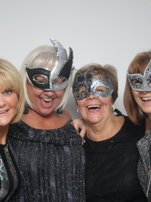 A well shot photo of four women laughing.