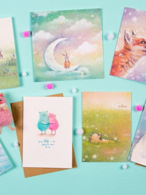 A well shot photo of some gift cards with cute animals on them.