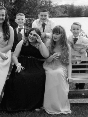 An image of a family gathered at a wedding